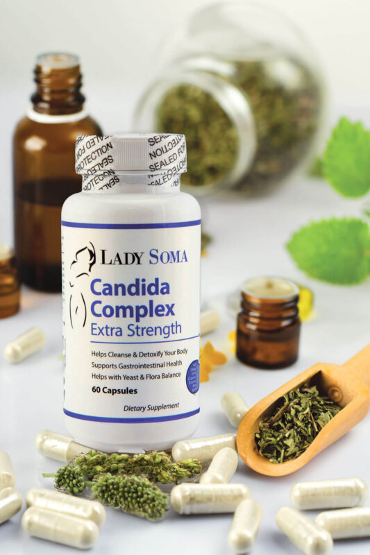 Natural Supplements & Healthy Skincare for Women close up medical capsules with herbs table Lady Soma Natural Supplements & Healthy Skincare for Women candida bottle with herbs